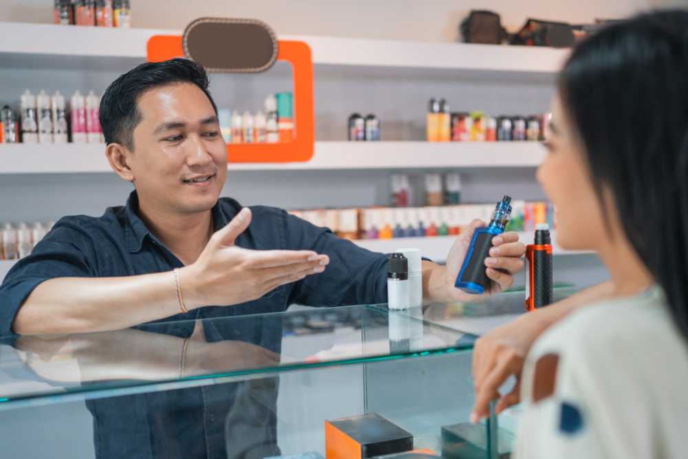 man showing off different vape carts