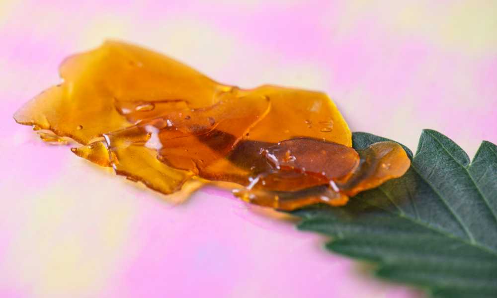 closeup shot of cured resin on cannabis leaf