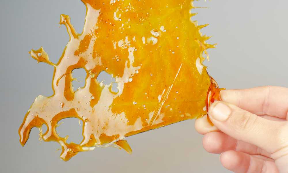 hand holding large piece of cured resin