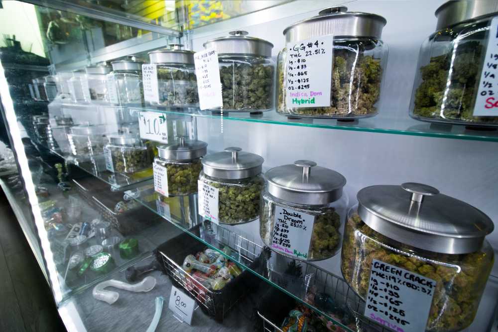 various jars on cannabis strains in display case