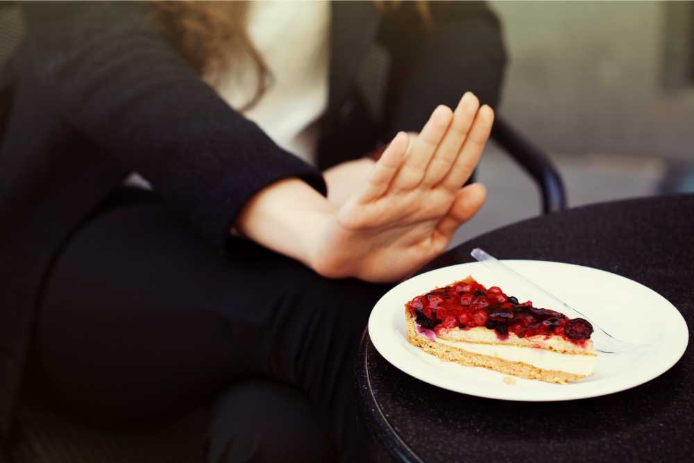 woman saying no to cherry pie hand extended